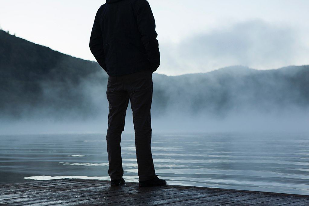 Fog surrounding standing man